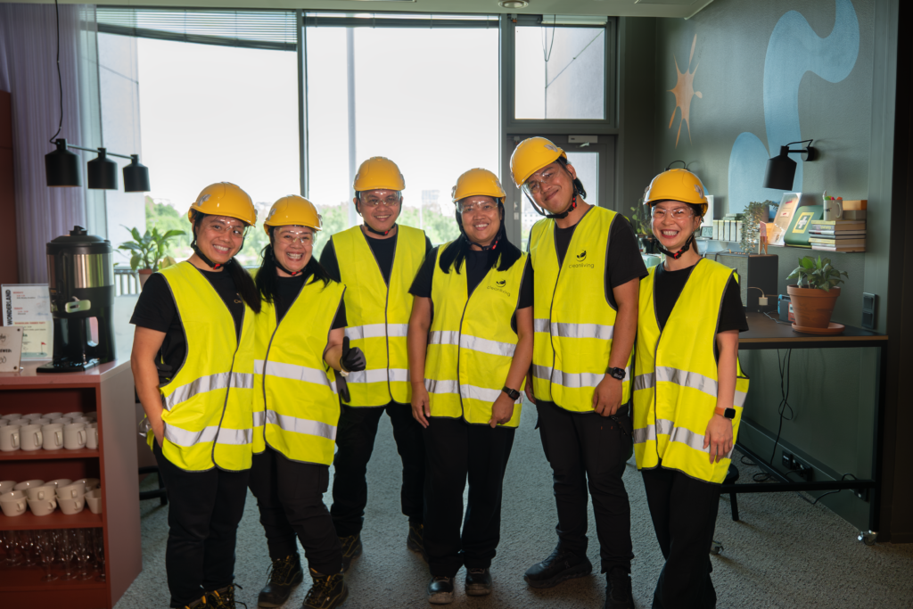 The CleanLiving team in branded safety vests and hard hats